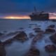 Seascape shipwreck at sunset